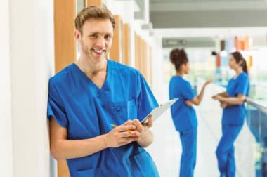 male nurse holding his pen and clipboard